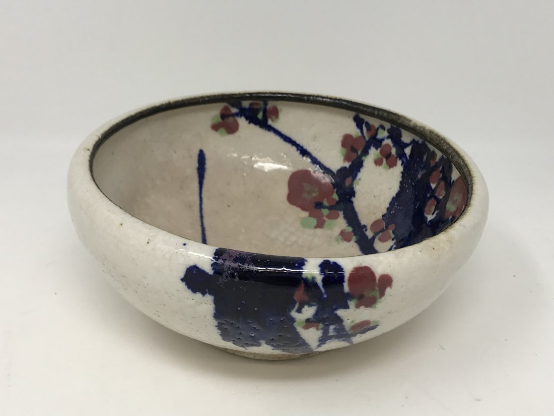 Japanese Antique Bowl: Antique Japanese bowl with hand painted decoration of three prunus flowers. . Measures 6 1/4 inches in diameter x 2 3/4 inches tall. Marked at the base and in good condition.