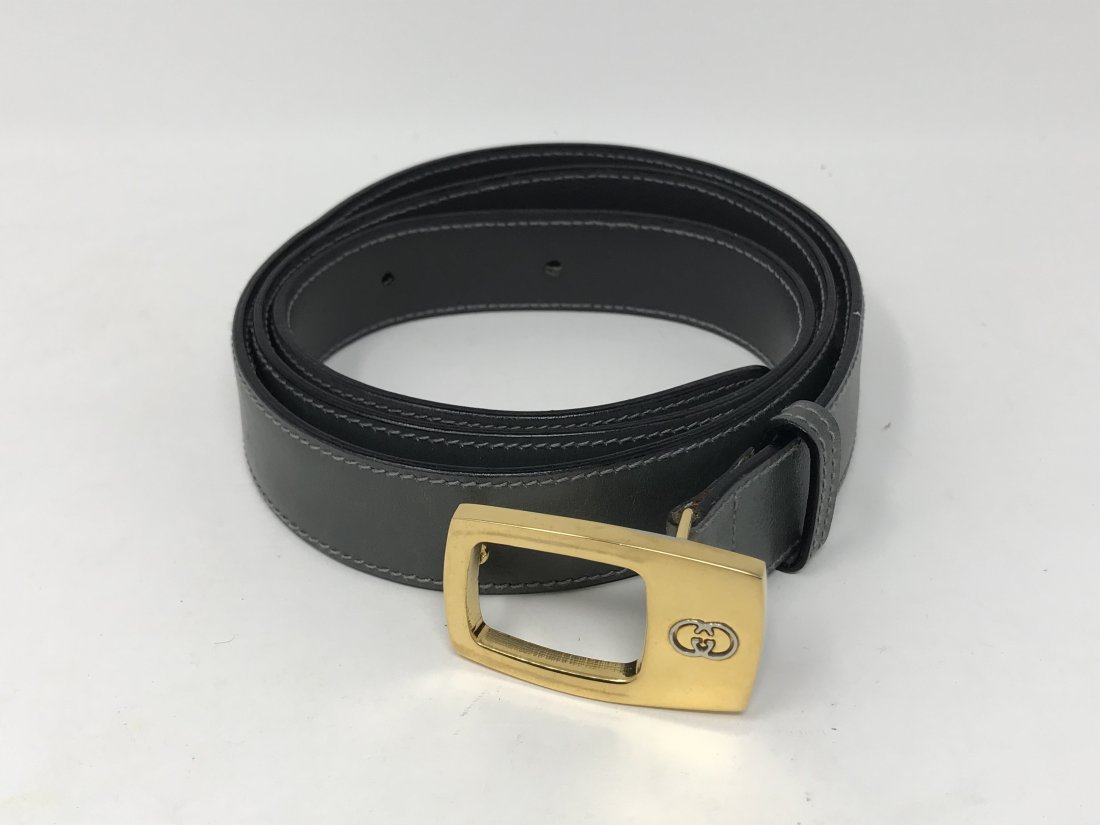Gucci Italy Leather Belt: Gucci Italy grey leather belt marked on the belt and on the strap. Measures 1 inches wide x 36 inches (90cm) long. Preowned good condition.
