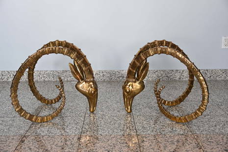 Two Bucranes Table Bases Attr. Alain Chervet: Pair of Brass table bases representing two bucranes attributed to Alain Chervet. Measures 18 1/2 inches x 22 1/2 inches x 22 1/2 inches. In good used condition. *Oversized Item, Please contact the auc