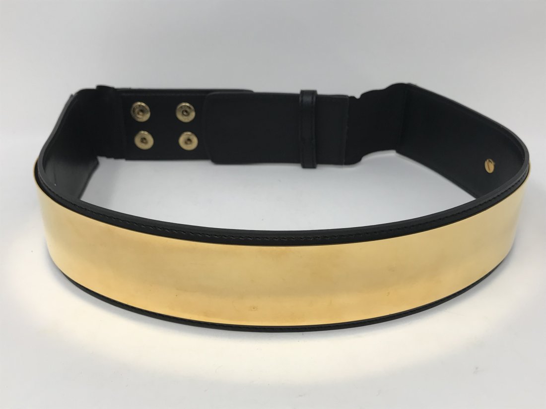 Stella McCartney Belt: Stella McCartney metal-plated waist belt in black faux leather and elastic band. Closes with a nap button, size M, 2 inches wide. Item is preowned, in good condition.