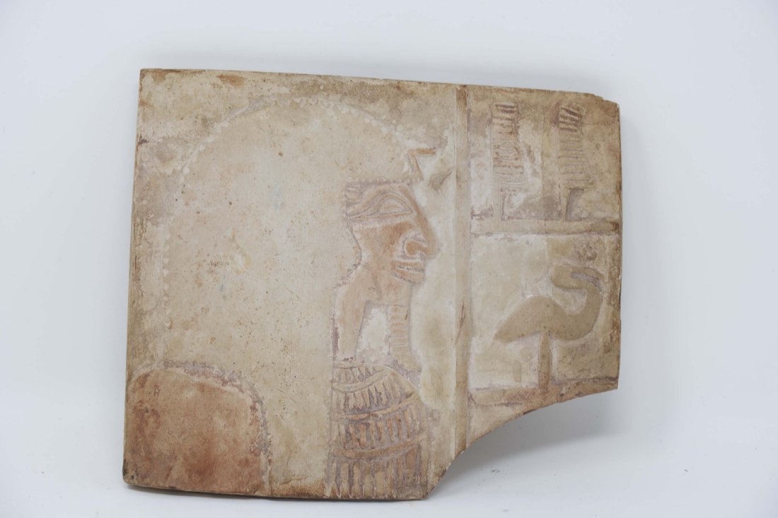 Fragment of Limestone Head of Pharaoh Relief: Antique fragment limestone pharaoh's head relief with duck and symbols, measures 10cm x 11 1/2 cm, trace of color.