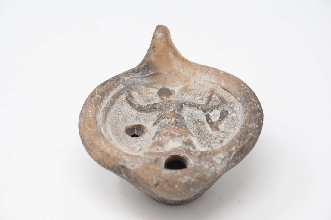 Antique Roman Clay Archer Oil Lamp: Antique Roman clay archer oil lamp, measures 4 inches long x 3 inches in diameter x 2 1/4 inches tall. In good condition.