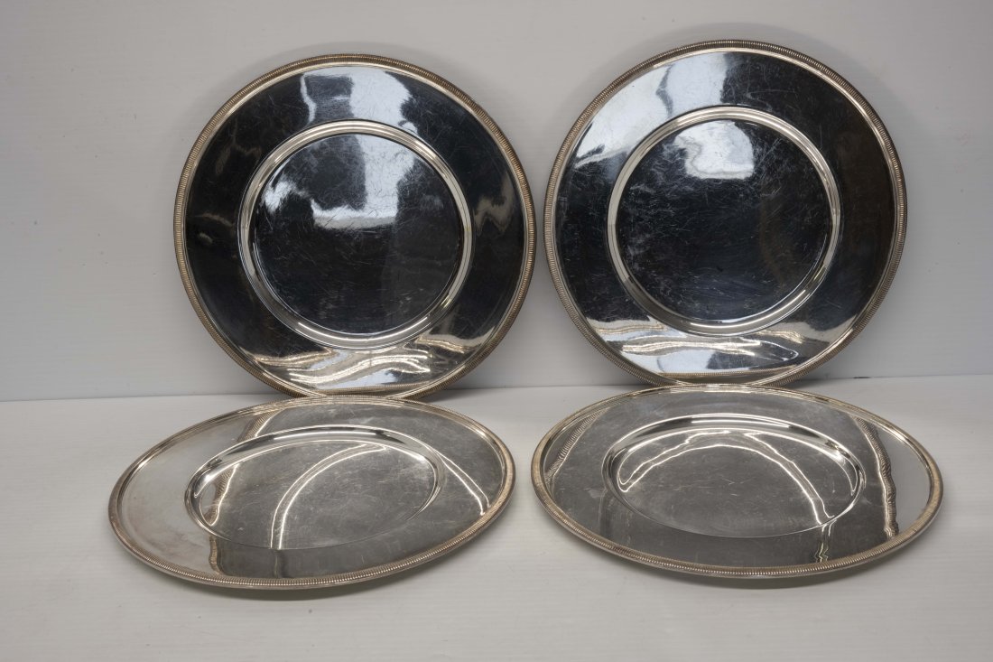 Christofle France Set of Four Gallia Plates: Christofle Gallia design set of four 11 1/4 inch plate. Silverplated stamp on the back, minor surface scratches, preowned.