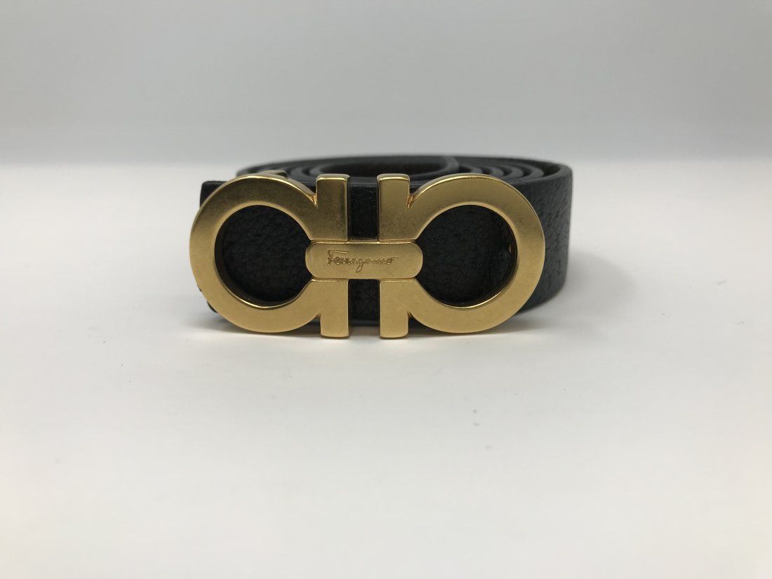 Ferragamo Woman Reversible and Adjustable Black Belt: Ferragamo Woman's reversible and adjustable gold tone belt black and brown leather, measures 35 inches long, preowned.