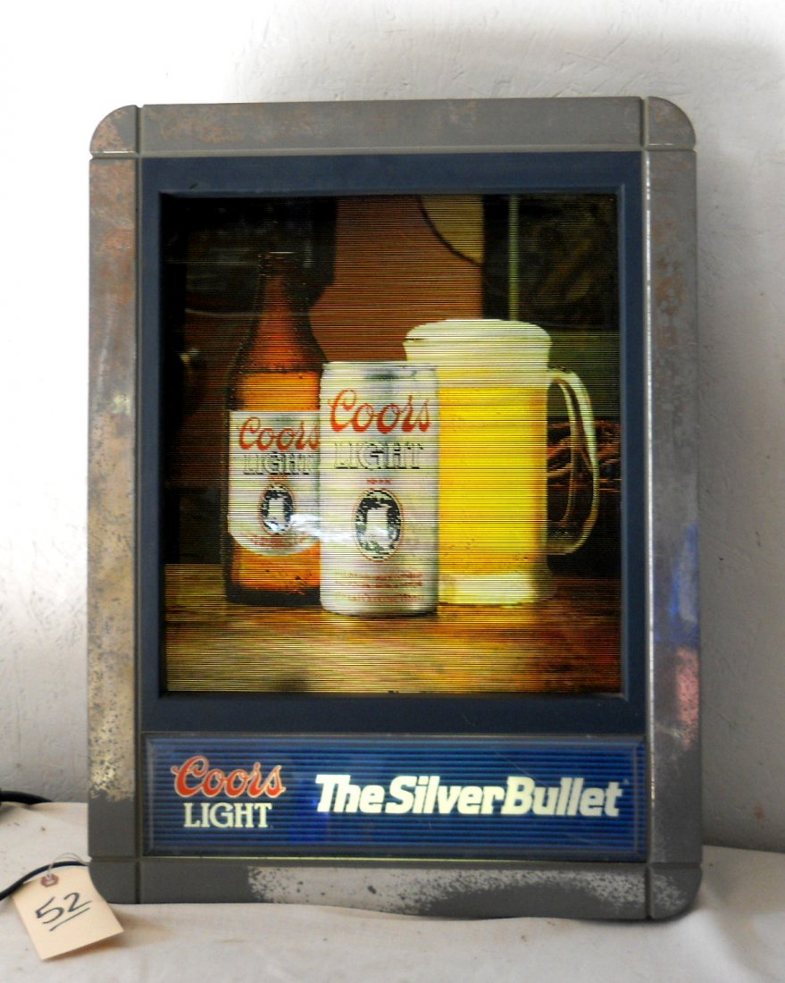 COORS LIGHT Silver Bullet Changing Screen Sign: Vintage COORS LIGHT Silver Bullet Changing Screen Sign. Depicts three scenes from the 1980s. 24” H x 18” W Working.