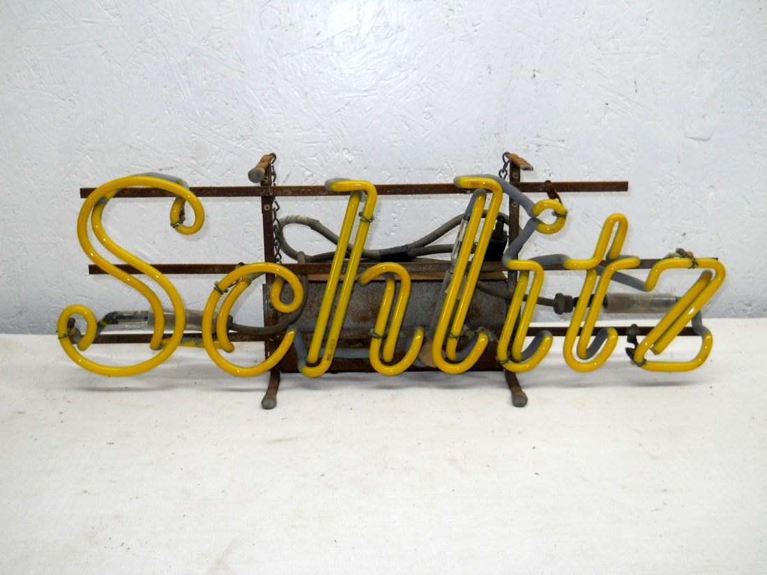 SCHLITZ BEER Neon Sign: Vintage SCHLITZ neon light advertisement. Does not light up. Just the word, yellow neon, “The Beer the Made Milwaukee Famous” printed on back. 22.5” H x 8.25” W x 6” D