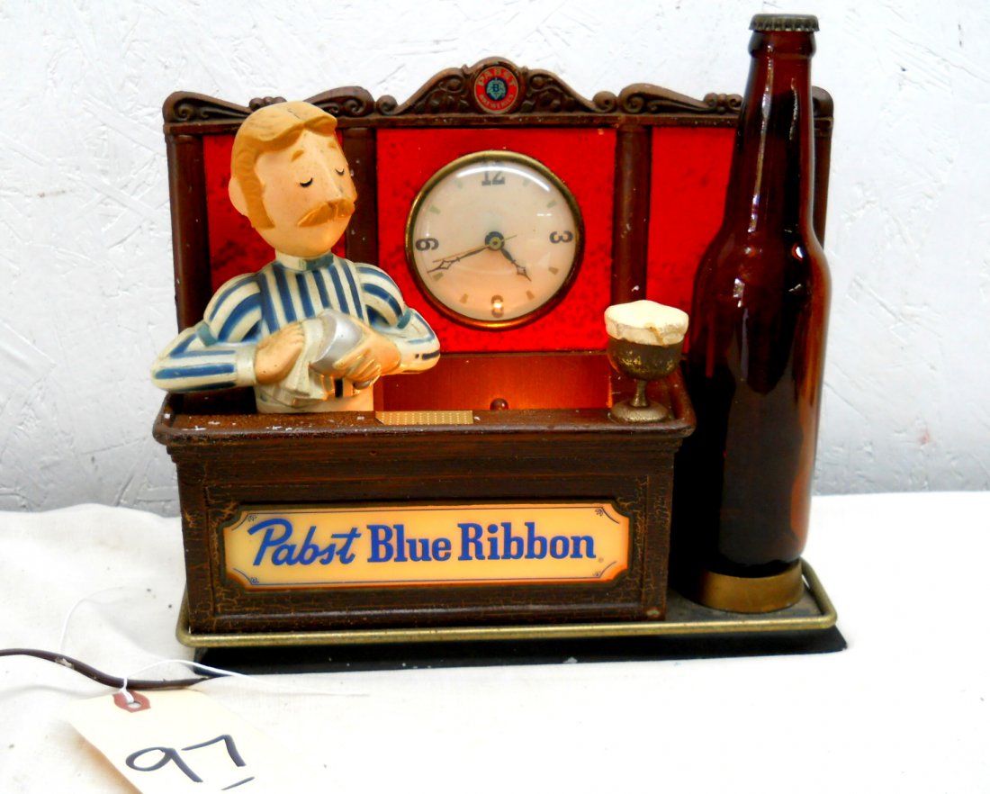 PABST BLUE RIBBON BEER Bartop décor w/Clock: Vintage PABST BLUE RIBBON BEER bar top advertisement. Bartender figure behind bar with clock at top, beer bottle with PBR cap, but no label. 9.5” H x 11.5” W x 6.5” D