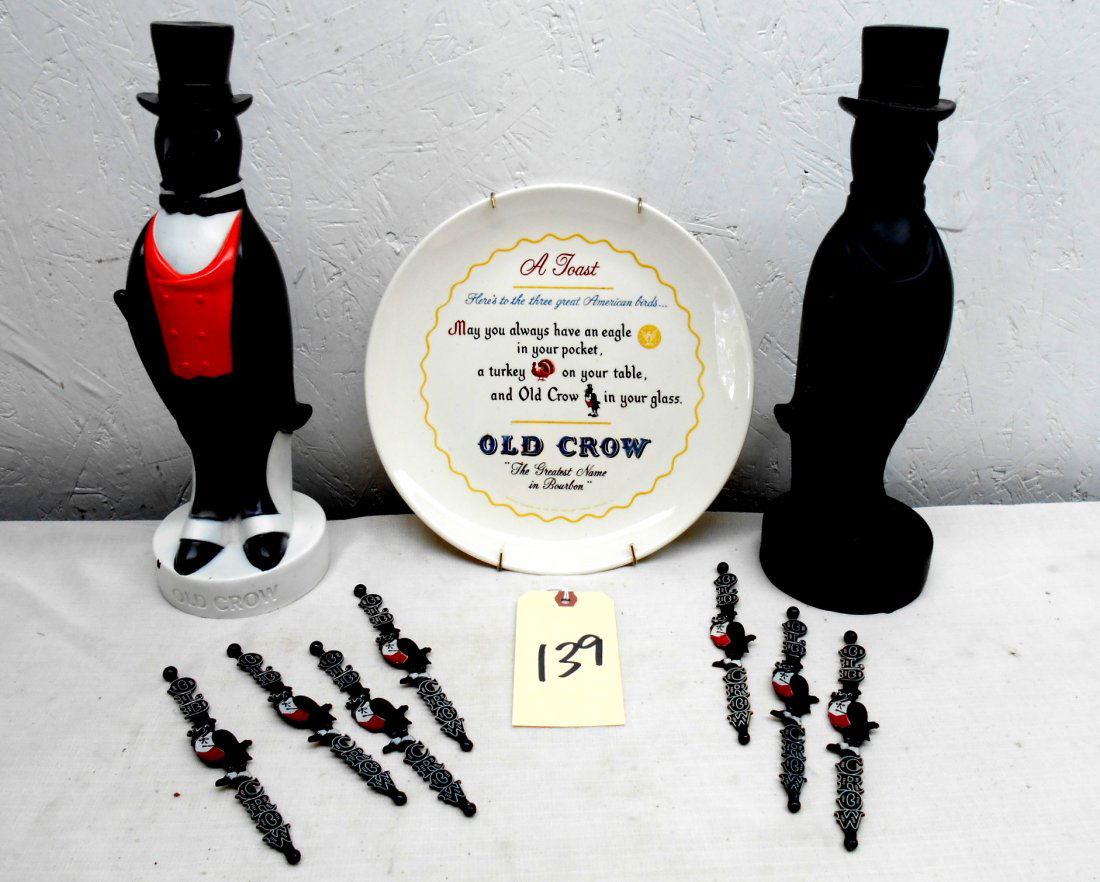 OLD CROW BOURBON - Misc. Advertisment: Vintage 10 Pc Lot – Two Vinyl Crow Figures (1 black with some scratches, 1 painted with red and white), 7 Plastic drink Stirrers with OLD CROW logo and icon, and 1 Plate with wall mount with a toast