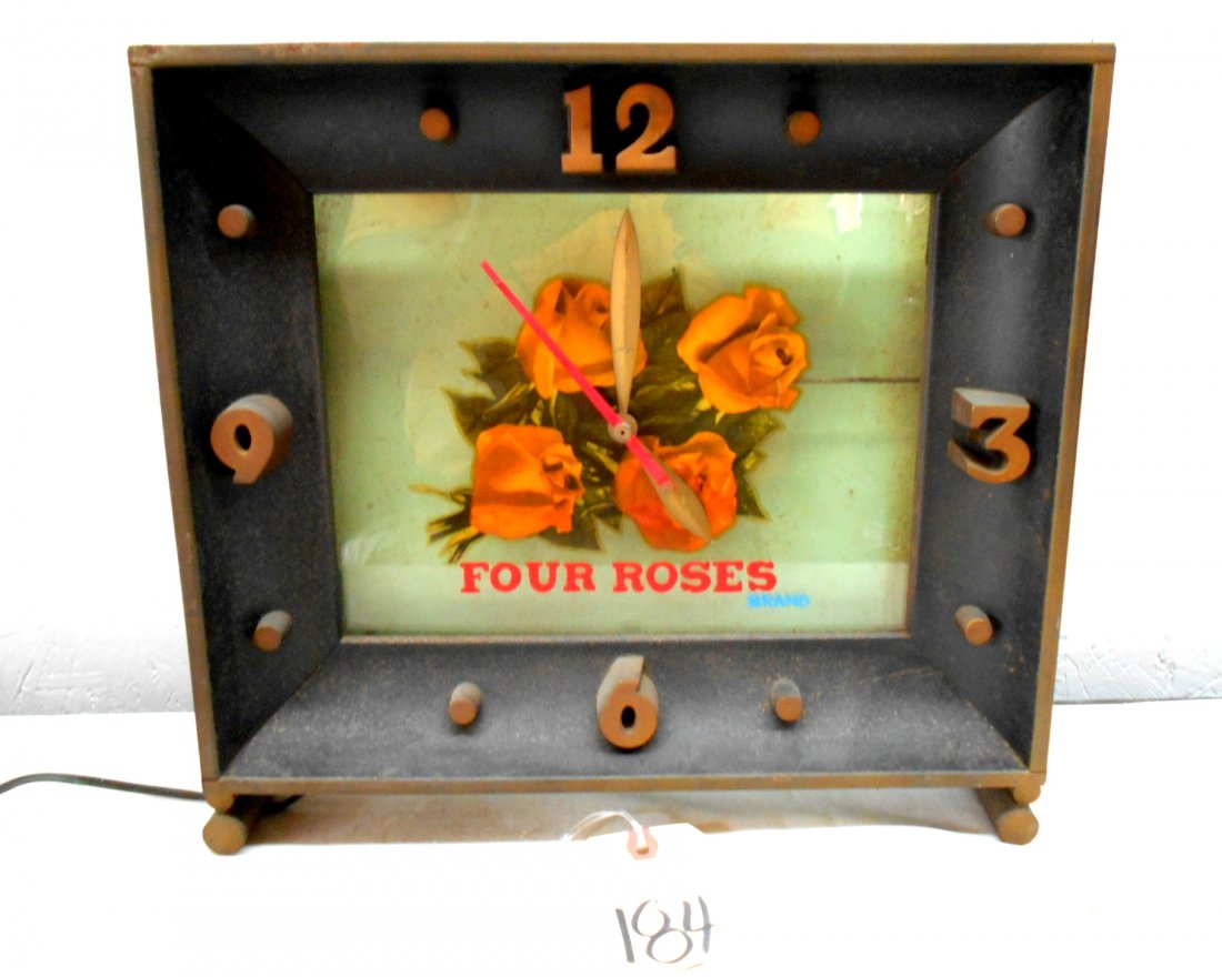 FOUR ROSES Clock: Four Roses brand whiskey vintage advertisement clock with second hand. Clock runs. Needs new light bulb.13.5” H x 15” W x 4” D
