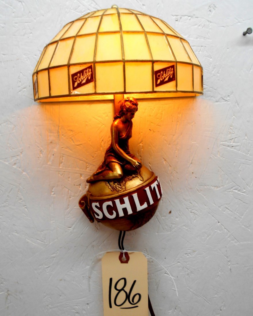 SCHLITZ BEER Light Sconce: Vintage SCHLITZ Light Sconce with Faux Stained Glass shade. Golden girl series, girl sitting on globe, Works, light turns on. 11” H x 8” W x 4” D