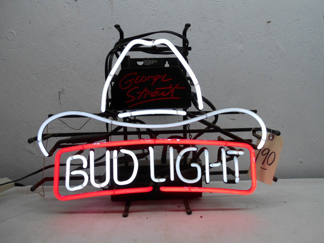 BUD LIGHT BEER Neon Sign - George Strait: Vintage BUD LIGHT neon advertisement sign. Red and white neon with Cowboy Hat and the text “George Strait”. 17.5” H x 23” W x 6” D