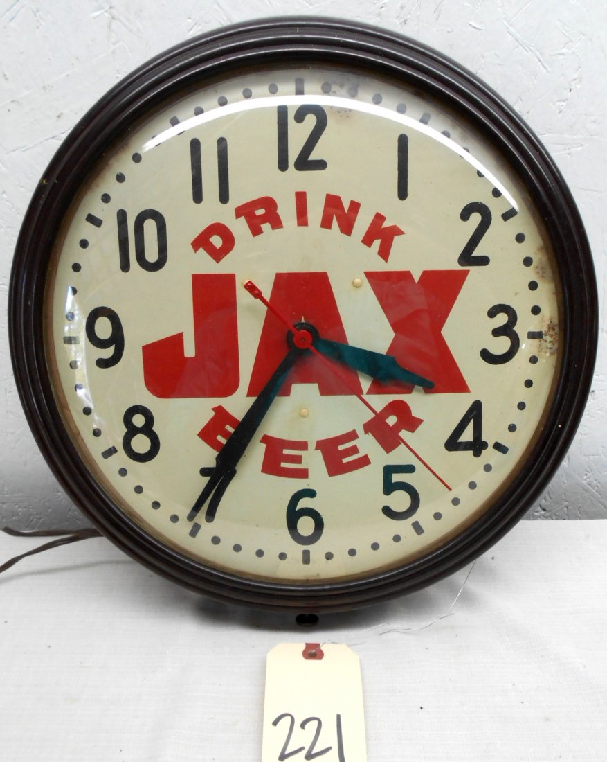 JAX BEER Clock: Vintage JAX BEER advertisement wall clock. Black, red and white wall clock with text "DRINK JAX BEER". Great style, plastic housing, glass dome, metal clock face, runs. Tiny spots of rust at 12 and 3.