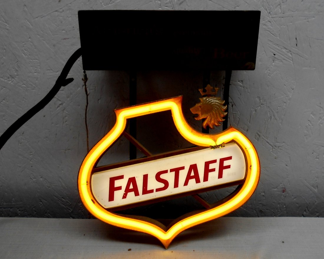 FALSTAFF BEER Neon Sign: Small vintage FALSTAFF BEER neon sign advertisement. Falstaff Logo with Yellow Shield in neon, lights up.. Top metal box has text, "America's Premium Quality Beer" 12" H x 9.5" W x 3.5" D