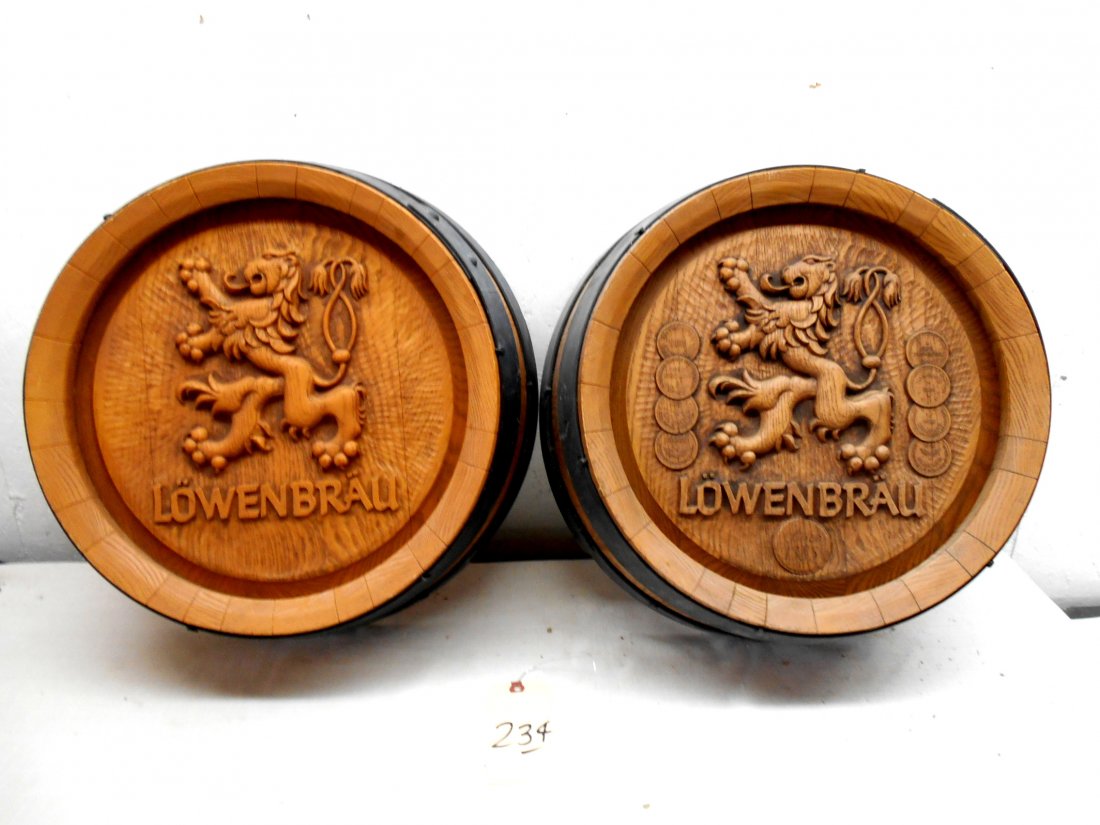 LOWENBRAU BEER Barrel Wall Hangings: LOWENBRAU BEER advertisement barrel wall hangings Two round faux barrel wall hanging with Lowenbrau logo. One features medallions surrounding the lion.18.25" Diameter x 6" Deep