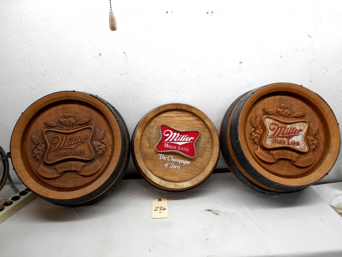 MILLER HIGH LIFE Beer Barrel Wall Hangings: MILLER HIGH LIFE BEER barrel wall hangings, 3pcs. Round faux barrel wall hanging with Miller High Life Beer logo. Assorted. Two large barrels measuring 17.5" Diameter and one small barrel measuring 15