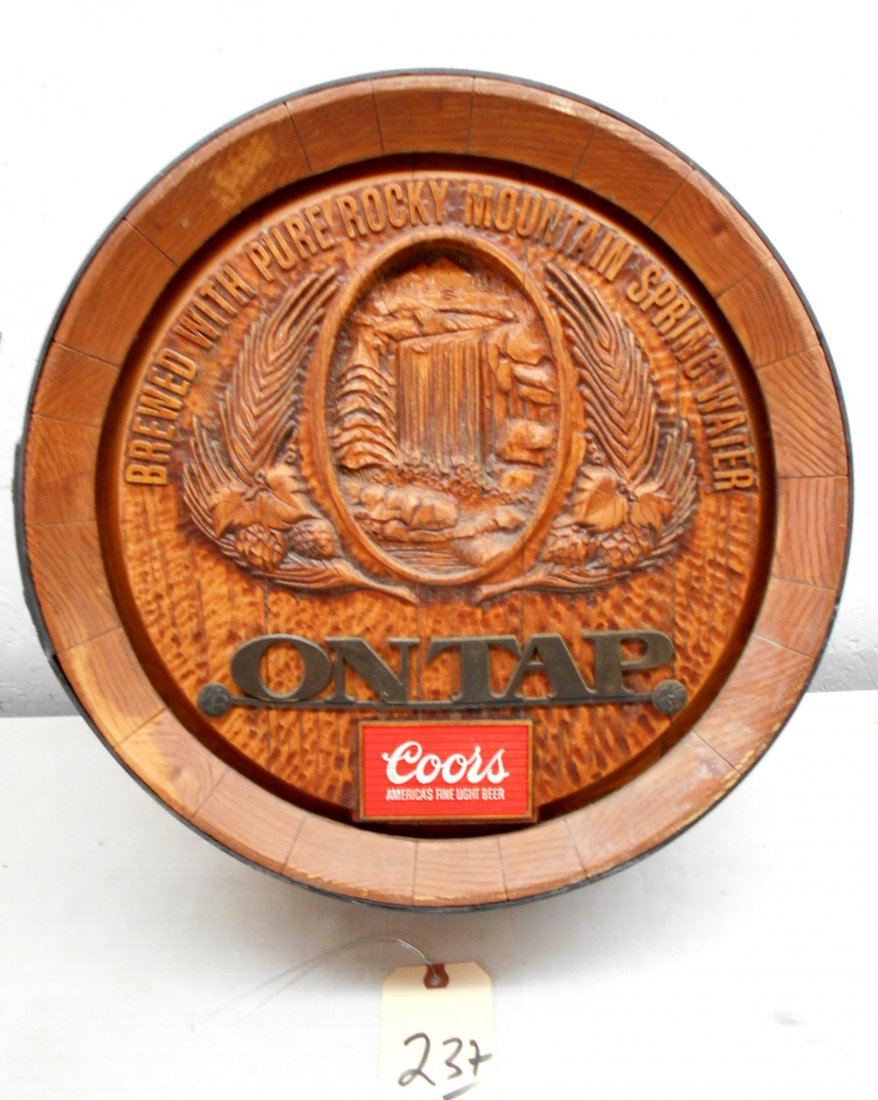 COORS BEER Beer Barrel Wall Hanging: Vintage Coors Beer wall hanging advertisement in the shape of a beer barrel top. Coors beer logo with the text,"On Tap". 18" Diameter x 5.75" Deep