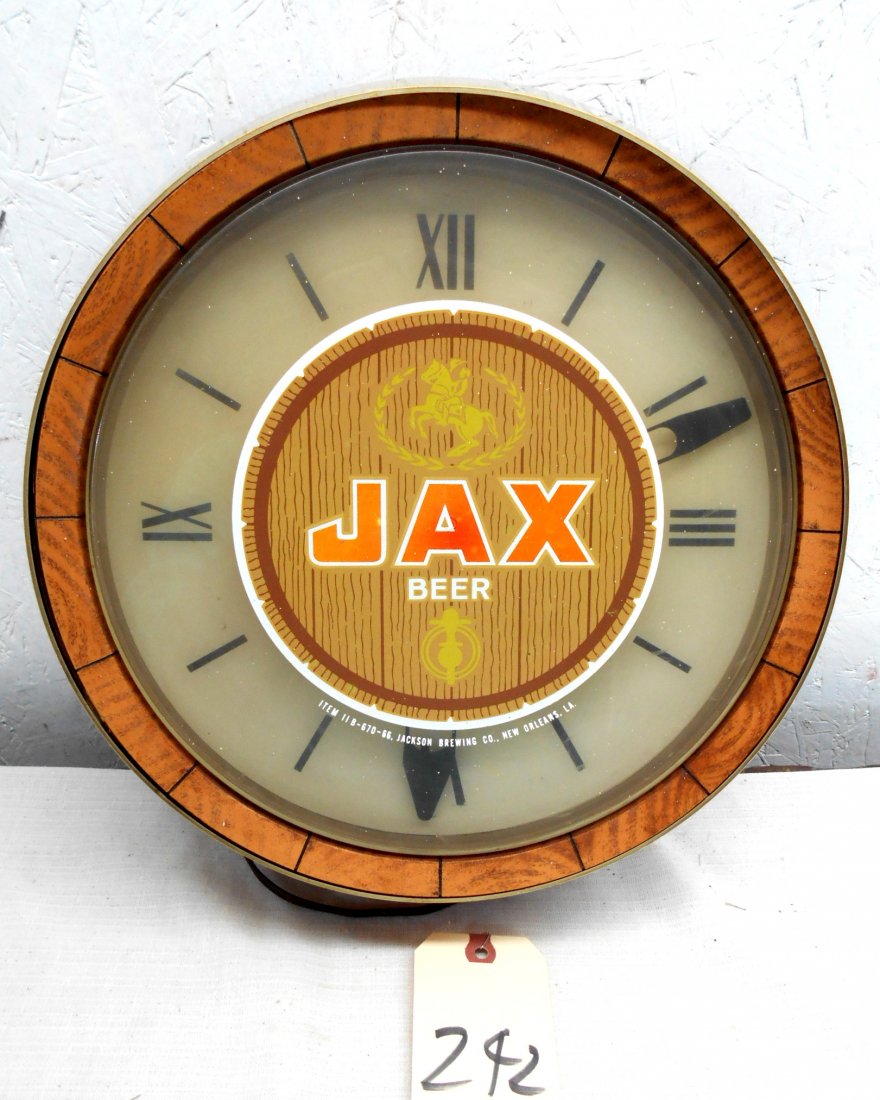 JAX BEER Clock: Vintage JAX BEER wall clock advertisement with Jax Beer logo on face. Clock runs. Gold metal rim and faux wood housing. 4.5" Diameter x 4" Deep