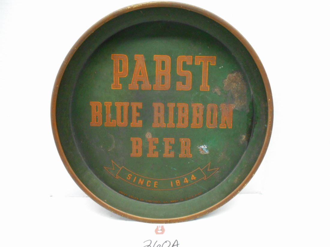 PABST BLUE RIBBON BEER Tray: Antique PABST BLUE RIBBON BEER tray. Very early metal tray in fair condition due to honest wear. Front with green background and gold letters. Back painted blue.(12" dia x 1" deep).