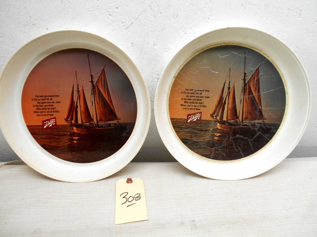 SCHLITZ BEER Trays: Lot of two identical vintage plastic Schlitz Beer trays. Image in center depicting a sailboat and Schlitz logo. One is damaged on face of image (see photos). 13" diameter x 1.75" D