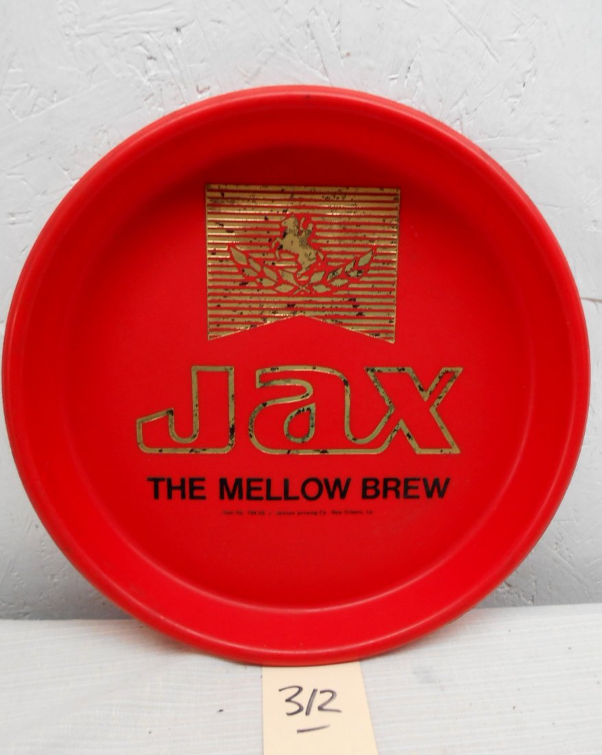 JAX BEER Tray: Vintage Jax Beer serving tray advertisement ,bright red plastic and gold Jax logo with the text, "The Mellow Brew" Good condition. 13" diameter x 1.5" D