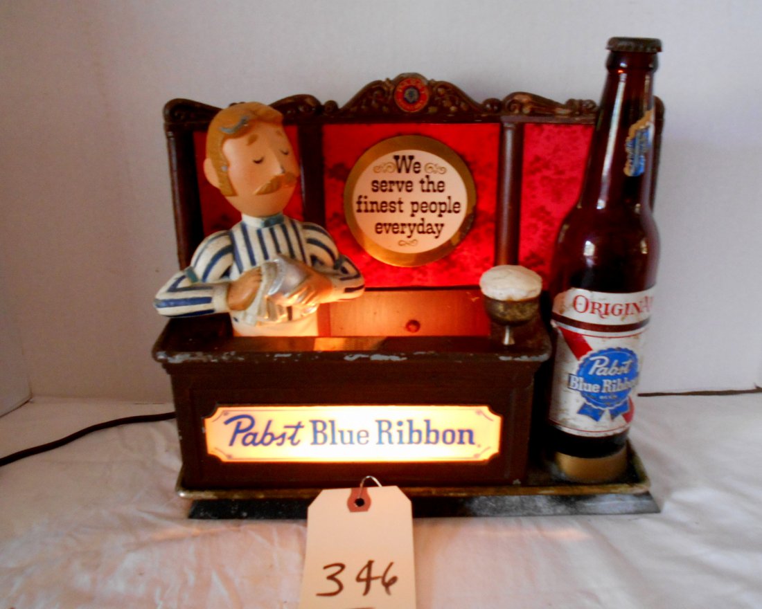 PABST BLUE RIBBON Bartop DÃ©cor: Vintage PABST BLUE RIBBON bar top dÃ©cor advertisement. Bartender cleaning a glass with glass beer bottle and text reads "We serve the finest people everyday". Metal, lights up. 10"X11.5"X4.5"