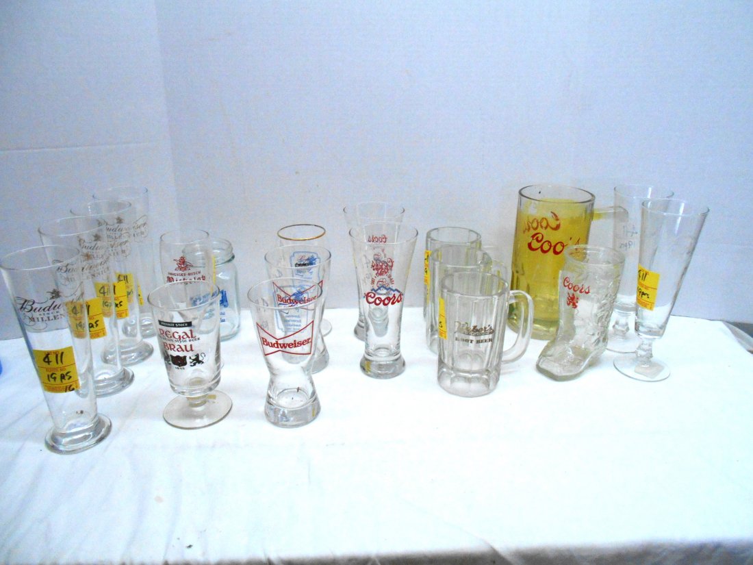 COORS, BUDWEISER, & REGAL - Misc. Glasses: 19 pcs. Vintage beer glasses . 4 matching tall Budweiser flutes, 2 matching Budweiser glasses, 2 tall etched Coors flutes, 1 small Coors boot glass, and other various glasses. 6"-8.5" tall