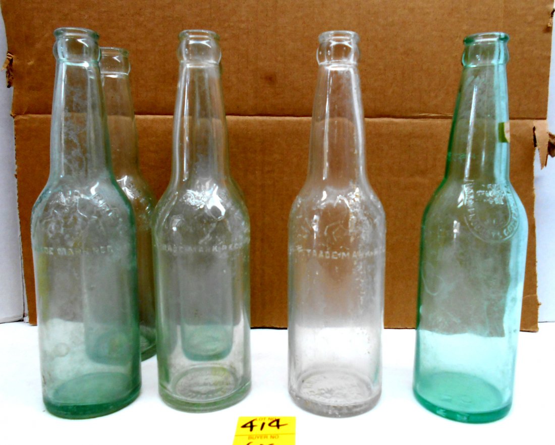 JACKSON BREWING & JAX BEER Green Bottles: 7 pcs. Vintage beer bottles. 4 "Jackson Brew Trademark Reg.", 2 "JAX Brew Trademark Reg.", 1 "Union Products Company, Inc. New Orleans LA Reg." (2nd "JAX Beer Trade Mark Reg." bottle not pictured) 9.5