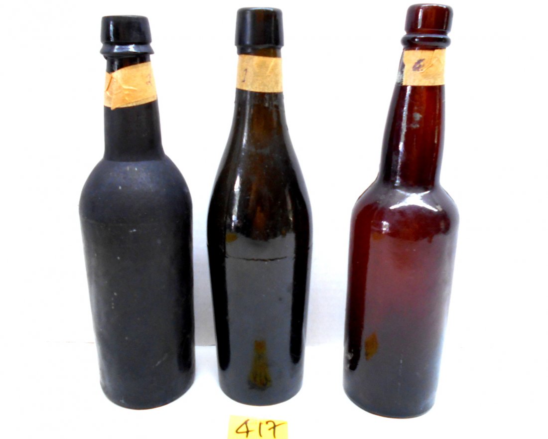 Antique Glass Beer Bottles: 3 pcs. Antique beer bottles. 1 brown-colored embossed with "EH GW 6" on bottom, 2 green/brown-colored. Very thick glass. 1860-1890? Very good condition 9.5-9.75" tall.