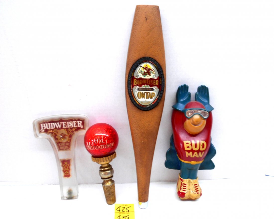 BUDWEISER & OLD MILWAUKEE BEER Misc. Tap Handles: 4 pcs. Vintage beer tap handles. 1 long plastic "Budweiser King of Beers on Tap" 14"X2.25", 1 accrylic with scratches "Budweiser King of Beers" 6.5"X4", 1 plastic "Bud Man" 8.5"X3.75", 1 round top "Ol