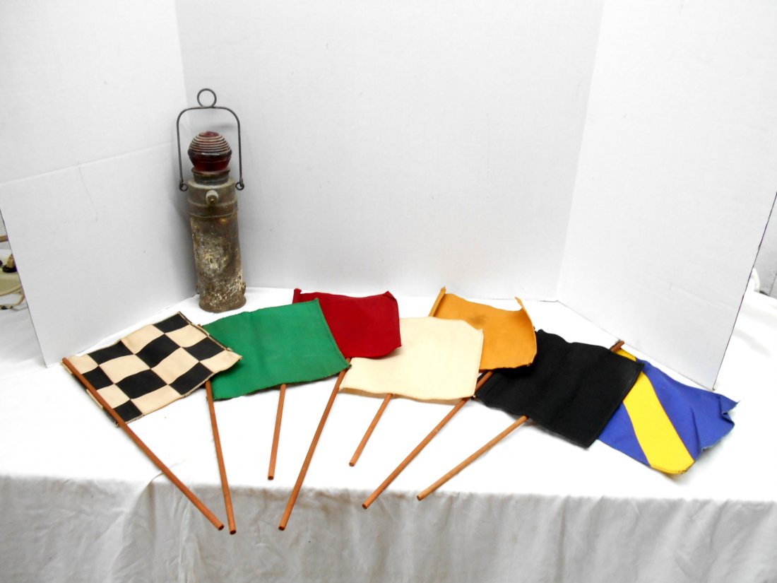 NAUTICAL MARINE Boat Lantern & Signal Flags: Vintage ship boat lantern and signal flags. 7 signal flags and small Lantern with Galvanized steel housing and red lense. Flags measure 7.5" X 7.5" with a 16" pole. Lantern measures 11" tall.