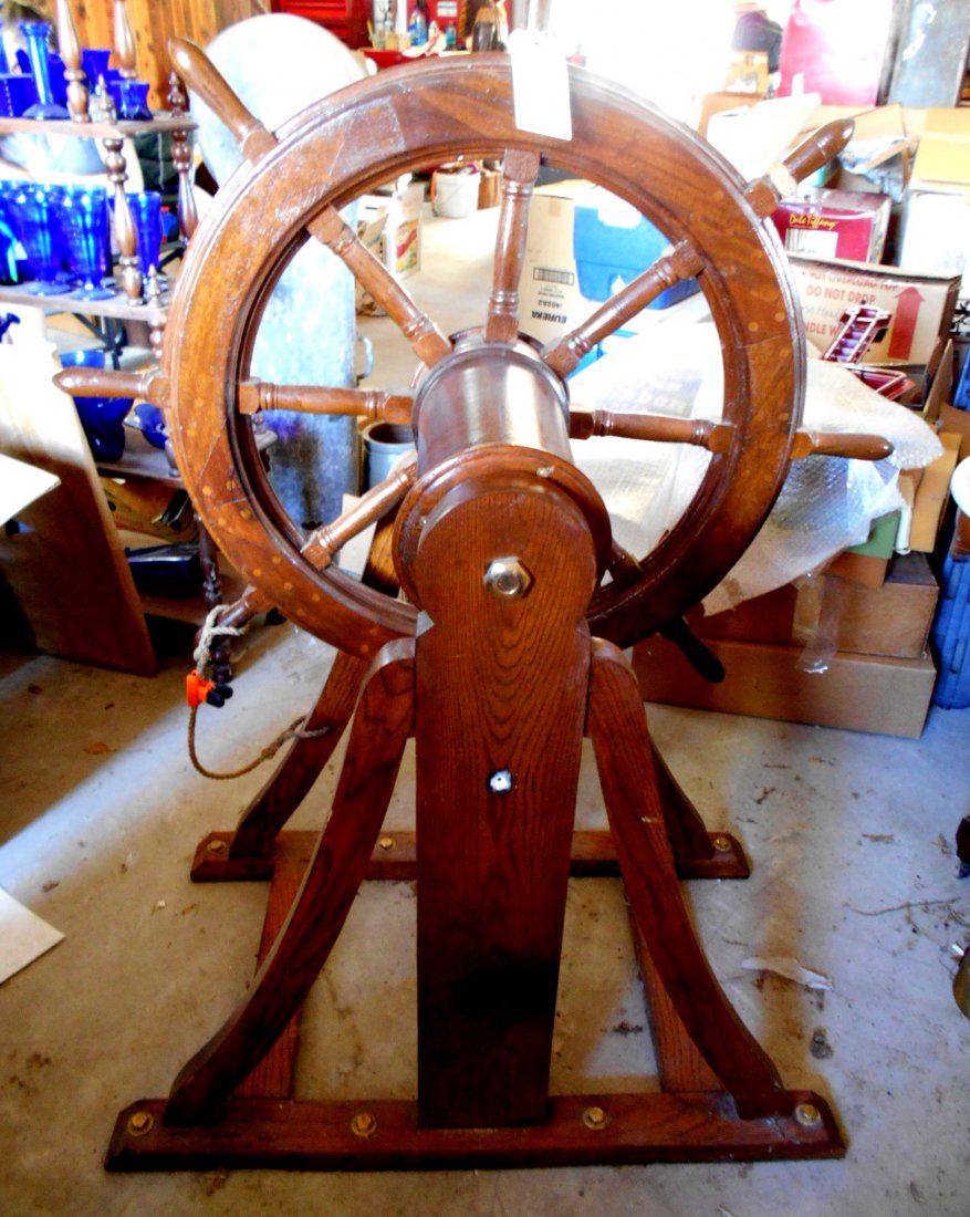 NAUTICAL MARINE Ship Wheel: Vintage mahogany? ship steering wheel on an oak stand. Wheel truns on stand. Wheel is 43" diameter, housing and wheel measure 54.5" tall x 21" deep