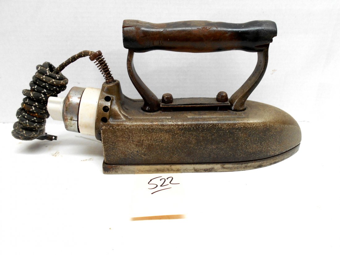 Antique Electric Iron: Antique Gross Star Electric Iron with fabric covered cord. Label reads "Gross Star, MFD By L. Behrstock Company 63 Van Buren St. Chicago." Also has serial number ? "5418". Measures 23.5" x 3.25" x 7"