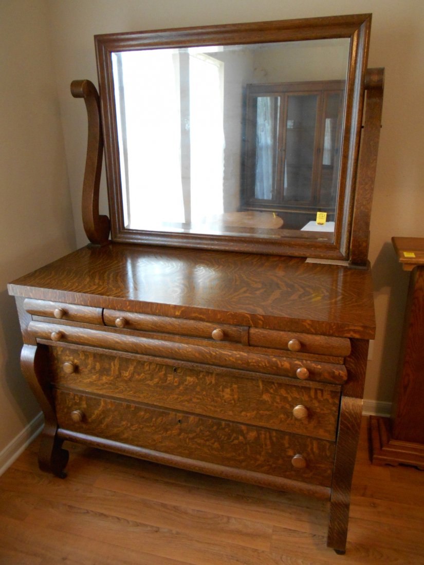 Antique American Oak Side Board/Dresser "“ Furniture: Large antique American sideboard/dresser. Cross sawn tiger oak. Finish very clean (refinished?). Mirror very good condition. 6 drawers Wood pulls. Large beveled glass mirror. Wood rollers on feet. 6' 