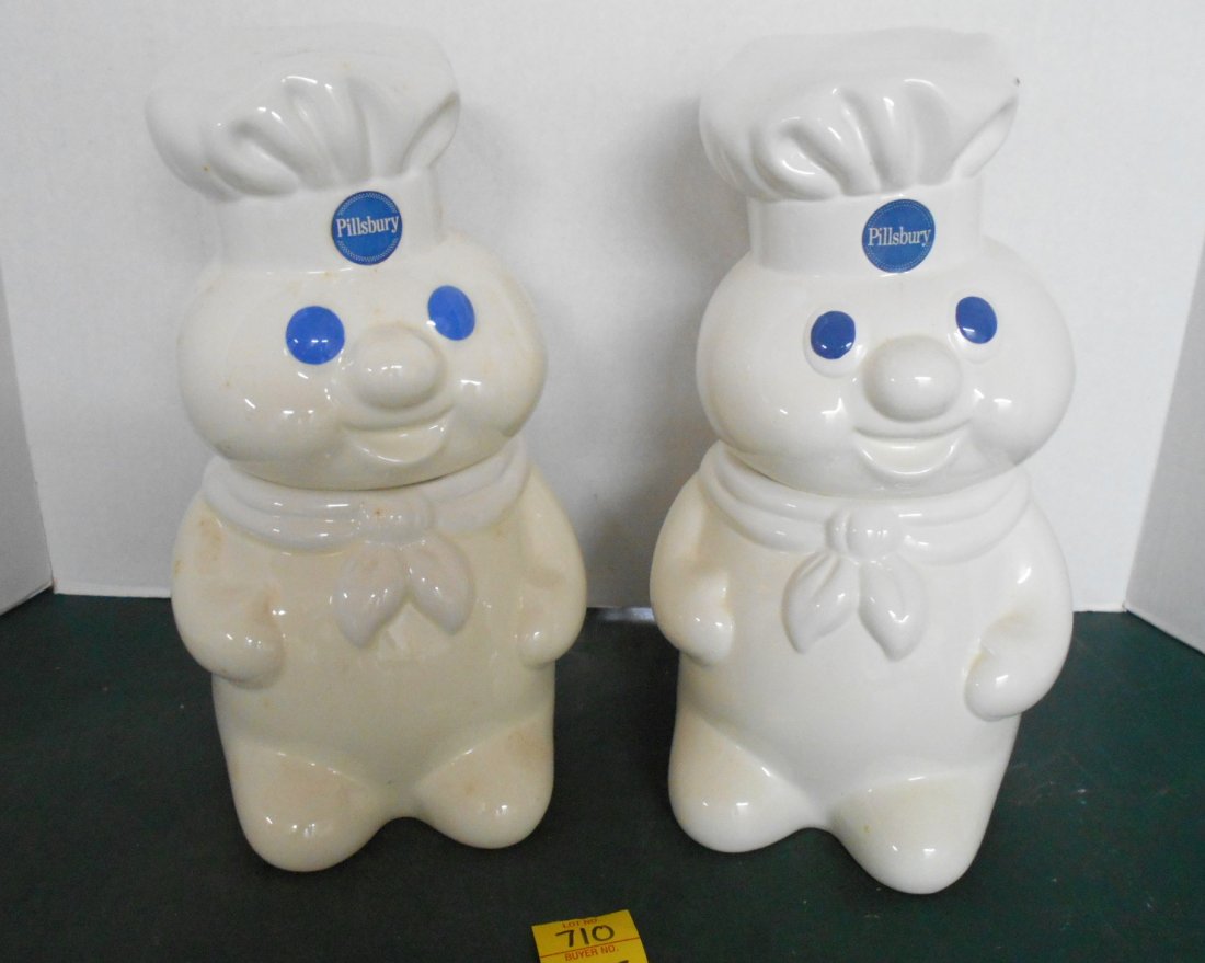 PILLSBURY DOUGHBOY Cookie Jars: 2 Pcs. Pillsbury Doughboy Cookie Jars, one makes "Hee-hee" sound when opened, with original box. The cookie jar one the right is dated 1988, the one on the left has no date. 12" tall