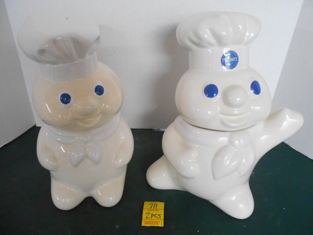 PILLSBURY DOUGHBOY Cookie Jars: 2 Pcs. Pillsbury Doughboy Cookie Jars with original box. The one of the left is dated 1995, the one on the right is dated 1997. 12" tall