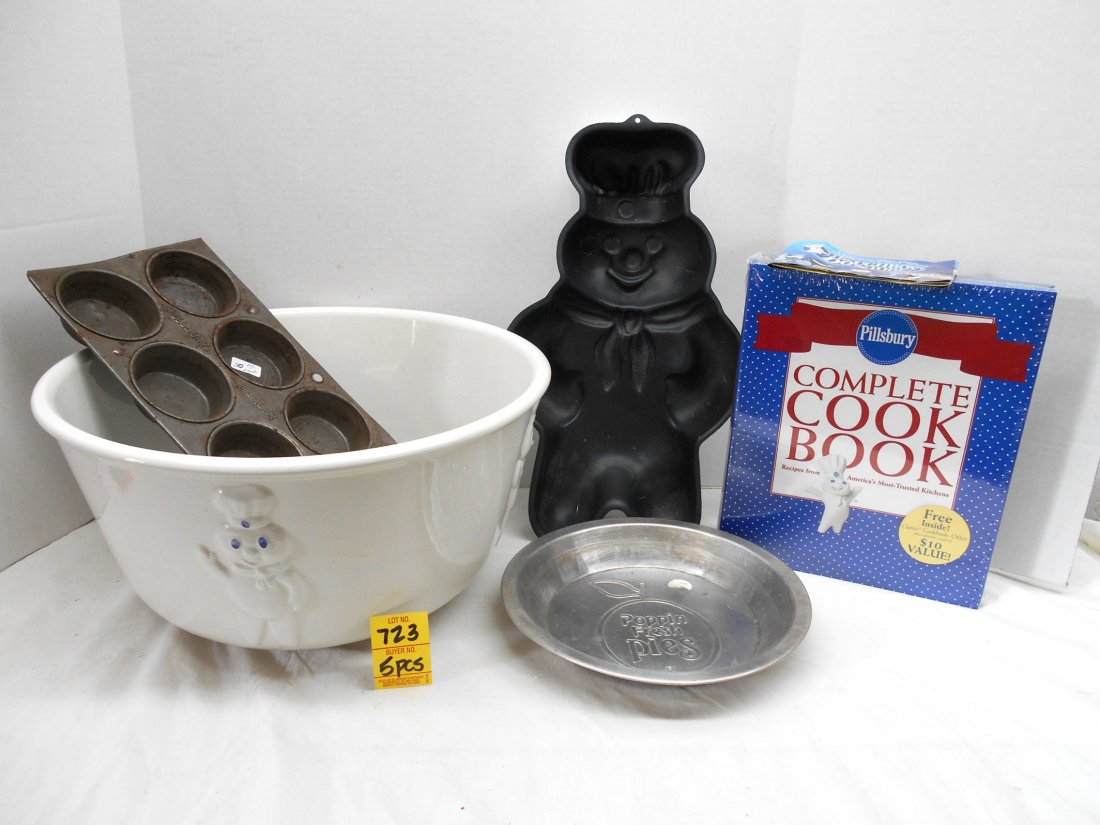 PILLSBURY DOUGHBOY Kitchen & Baking items: 5 Pcc. Large "dough bowl" (new in box "“ 14" diameter x 7" tall), metal cake form, pie tin, vintage Pillsbury muffin tin, and cook book.