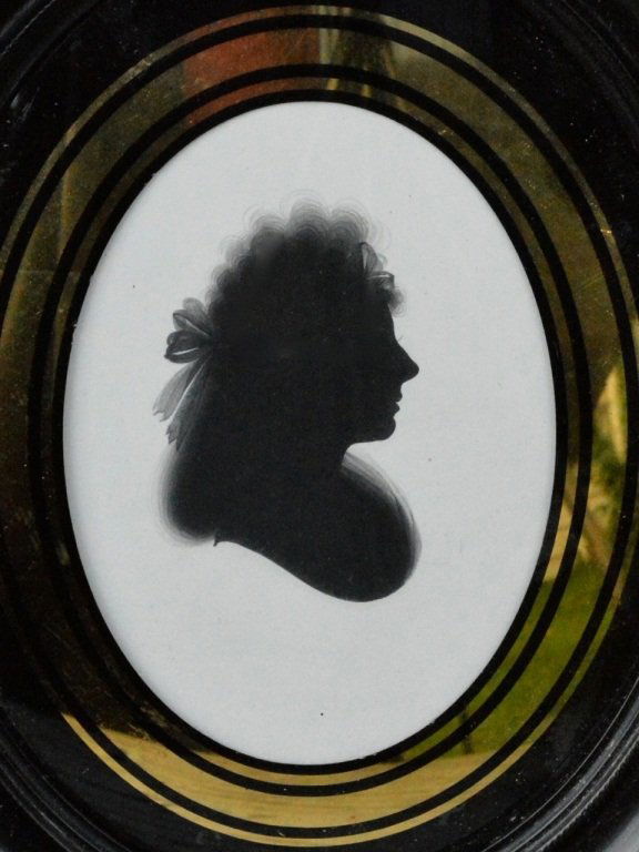 Silhouette by Miers: Painted silhouette of Mrs. Charles Moore by John Miers (1756-1821), painted black pigment on plaster, 7 X 5 3/4 inches overall, original frame and reverse painted convex glass mat, Miers label, togeth
