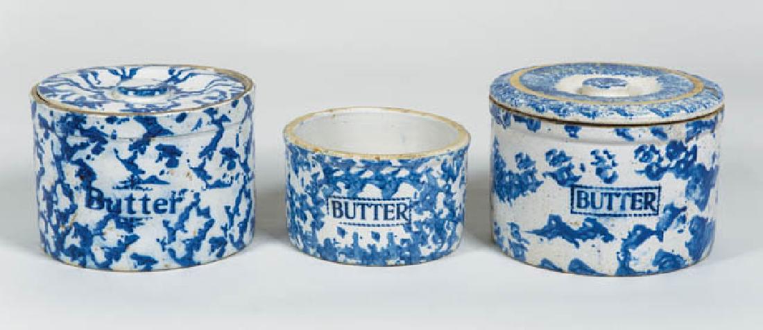 THREE ANTIQUE SPONGEWARE BUTTER CROCKS Blue and white,: THREE ANTIQUE SPONGEWARE BUTTER CROCKS Blue and white, two with lids, 5" h, one without lid and with age line, 4" h.
