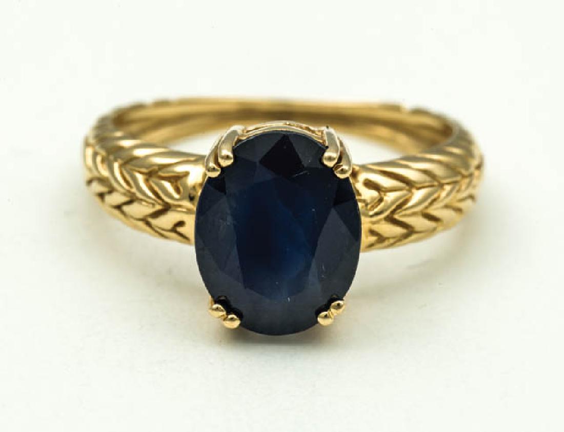 GOLD SAPPHIRE RING 14K gold ring with dark blue: GOLD SAPPHIRE RING 14K gold ring with dark blue sapphire, oval cut, from a Duxbury, MA estate, 10.42 x 7.94 x 5.05mm, size 7.