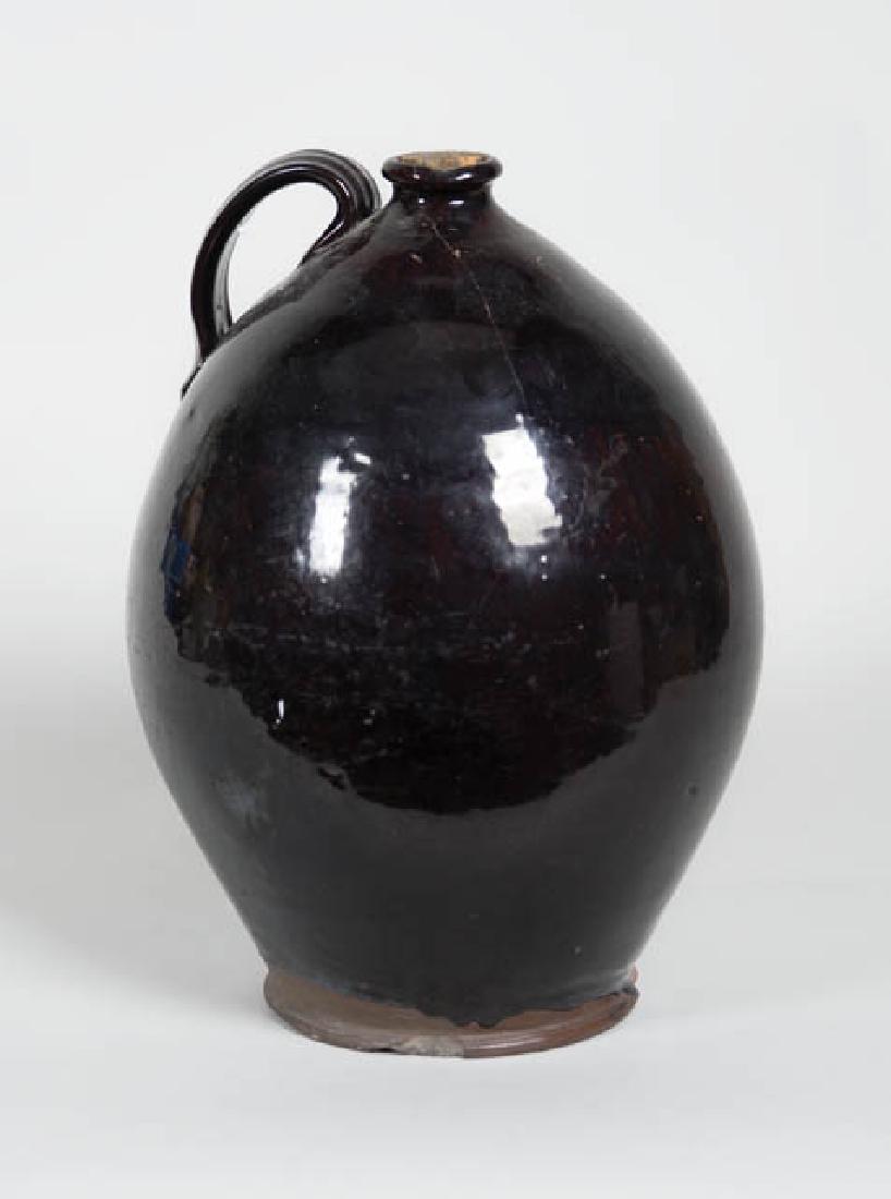 LARGE EARLY OVOID REDWARE JUG Dark brown glaze, applied: LARGE EARLY OVOID REDWARE JUG Dark brown glaze, applied handle, (chipped base), 13" h.