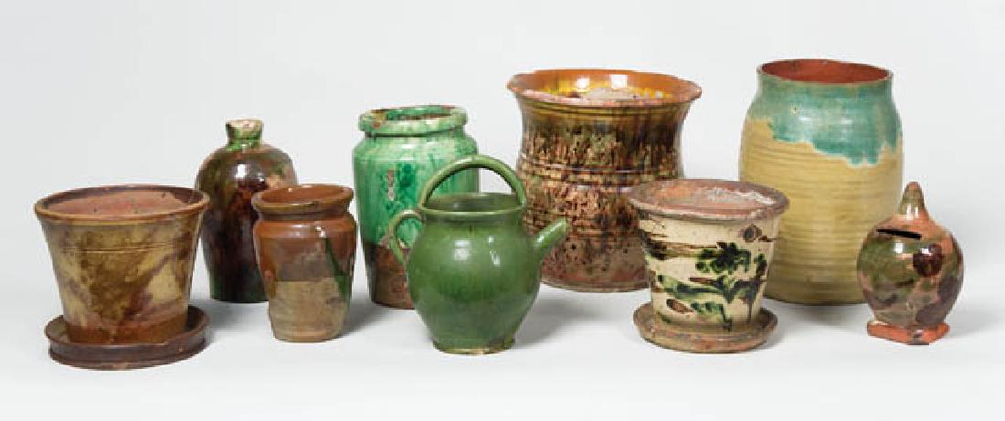 NINE 19TH C. REDWARE PIECES Jars, planters, a bank,: NINE 19TH C. REDWARE PIECES Jars, planters, a bank, bottle, etc., from "Shenandoah", mottled glazes, greens, browns, etc., (flower pot repaired), various in-use conditions, chips and cracks, 5" to 8 1