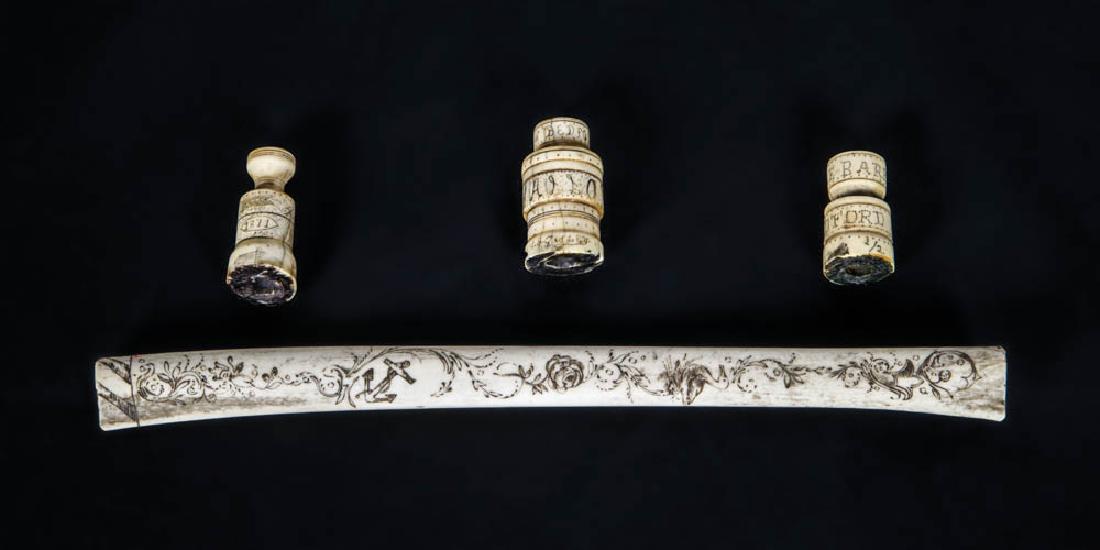 SCRIMSHAWED "ALBATROSS" Leg bone finely scrimshawed: SCRIMSHAWED "ALBATROSS" Leg bone finely scrimshawed with an albatross, flowers, anchor, young lady, and eagle and shield, 11" l; along with three 20th c. whalebone whale stamps, all with scrimshaw, 1 