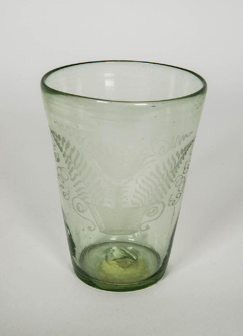 18TH/EARLY 19TH C. FLIP GLASS AND MUDDLES Blown aqua: 18TH/EARLY 19TH C. FLIP GLASS AND MUDDLES Blown aqua green glass flip, with wheeled etching of a basket with ferns and a tulip, broken pontil on base, 6 1/4" h; includes two muddle stirs.