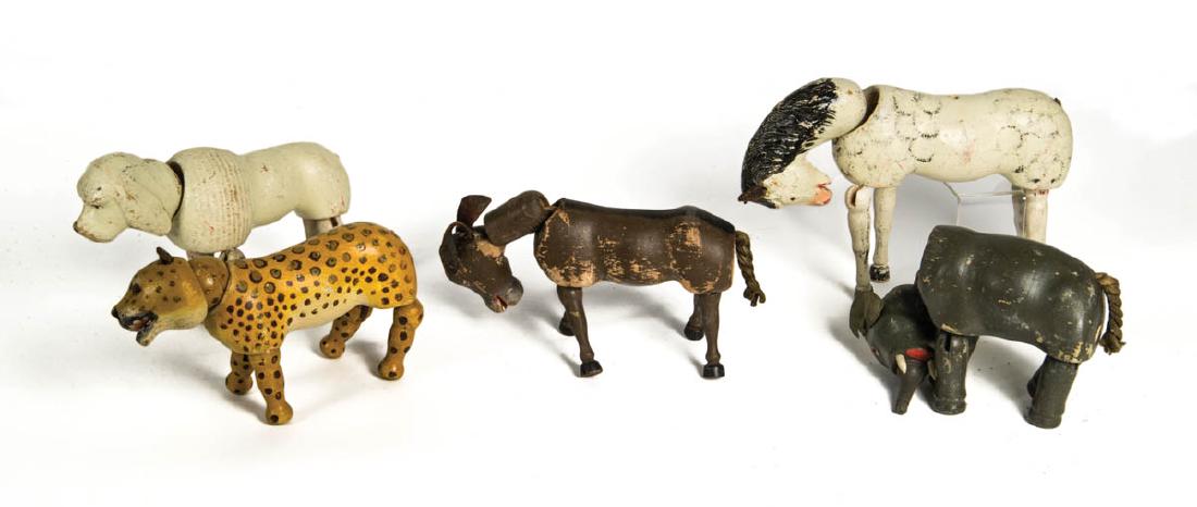 SCHOENHUT CARVED TOY ANIMALS: SCHOENHUT CARVED TOY ANIMALS Leopard, dog, horse, elephant, and donkey, (horse missing two legs and head detached, elephant missing one leg), fair condition, some paint loss.
