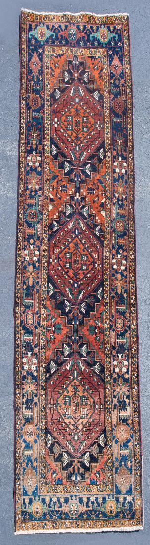 PERSIAN KARAJAH RUNNER: PERSIAN KARAJAH RUNNER Oriental rug, three medallions, brown diamonds with small figures in blue and stylized flowers, three borders, 3' 4" x 12' 8".