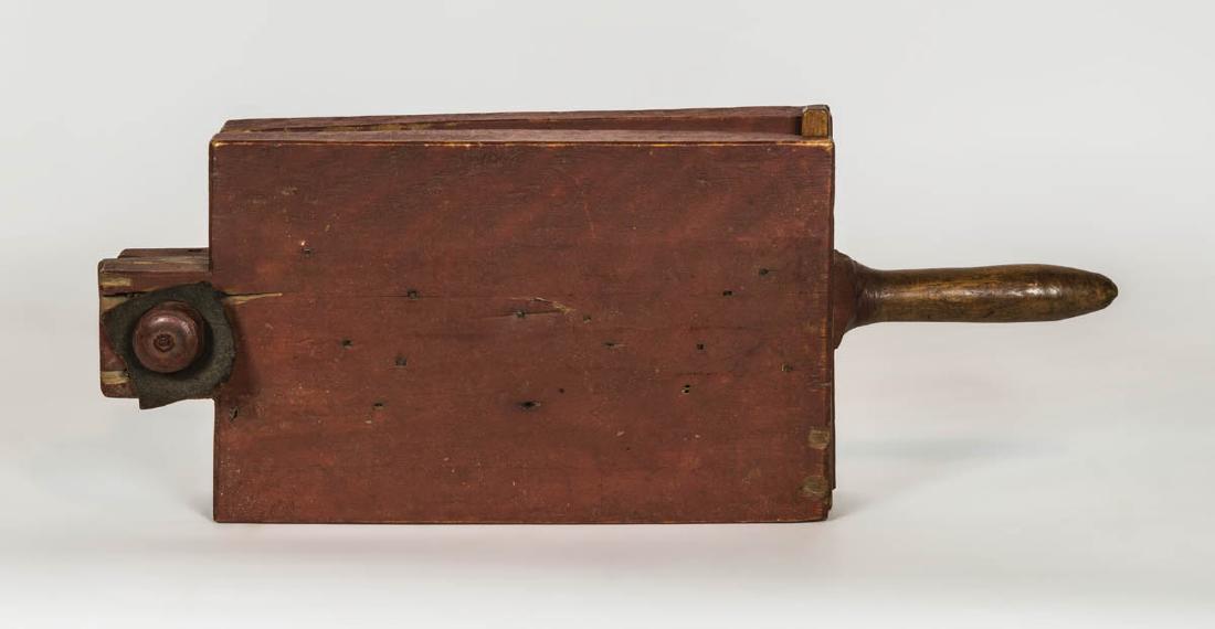 CORN SHELLER, AND TWO LARD PRESSES Maple, original red: CORN SHELLER, AND TWO LARD PRESSES Maple, original red painted finish, swiveling turned wood hinge, with hundreds of square nails on inside of both boards to shell the corn, long handle part of top bo