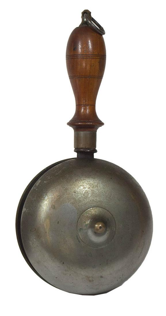 CIVIL WAR PERIOD DINNER BELLNickel plated brass camp: CIVIL WAR PERIOD DINNER BELLNickel plated brass camp dinner bell or gong, (also used by fire brigades), hand held with a wooden handle, minor wear, 10 1/4" l.