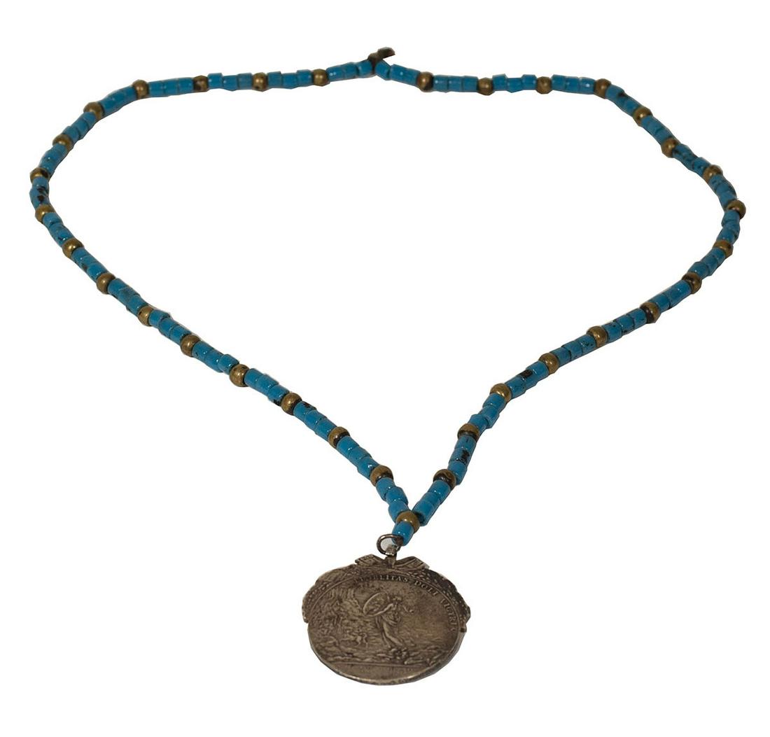 MEDAL ON BEAD NECKLACE1809 Mexican gilt bronze medal,: MEDAL ON BEAD NECKLACE1809 Mexican gilt bronze medal, "Ferdin Vii, Hispan Rex India Rvmqve Imperator" is on the front, and "Fidelitas Doli Victrix" is on the back, on a restrung bead necklace.
