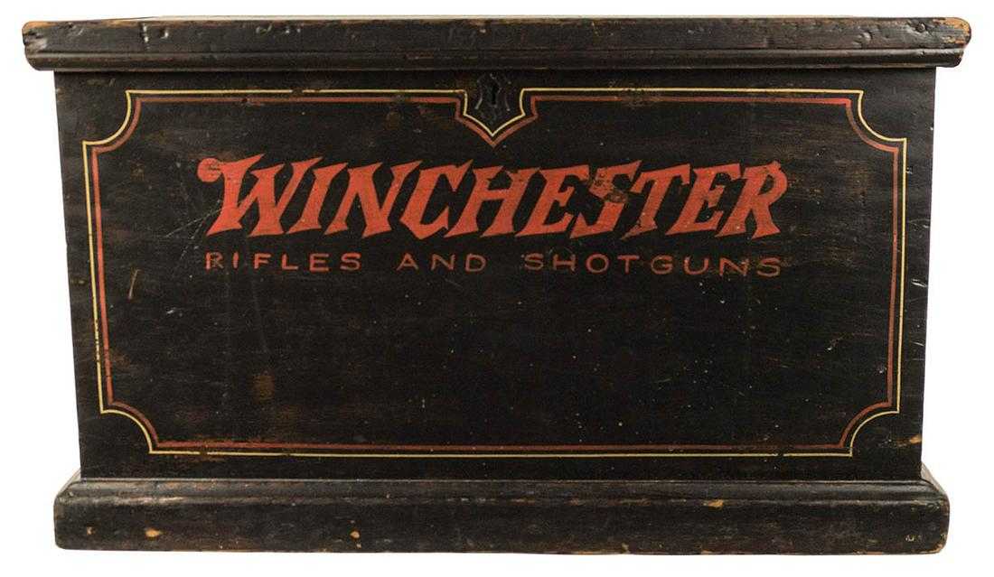 WINCHESTER TRUNKLift top wooden chest, with "Winchester: WINCHESTER TRUNKLift top wooden chest, with "Winchester Rifle" painted decoration and pinstriping, metal handles on either side, with wear, 18 1/2 h", 31 1/2" w, 17 3/4" d.