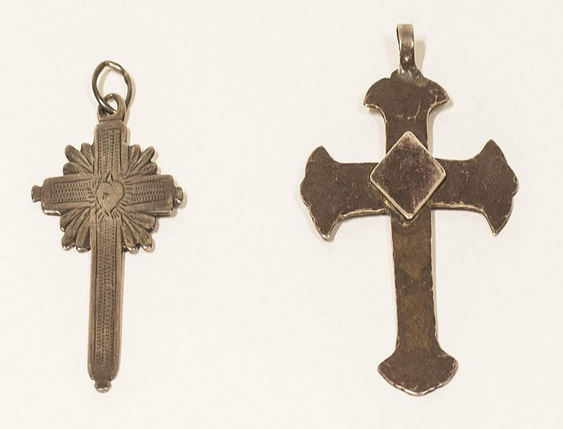 TWO CROSSESSilver sunburst cross with engraved detail,: TWO CROSSESSilver sunburst cross with engraved detail, attributed Indian trade items, thin, with minor wear, 2 1/4" x 1 1/4"; Hand hammered silver cross, thin with applied silver diamond in center, th